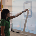 Using a white board system in high school class at harbor school