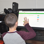 special needs high school student learning computer skills at the harbor school